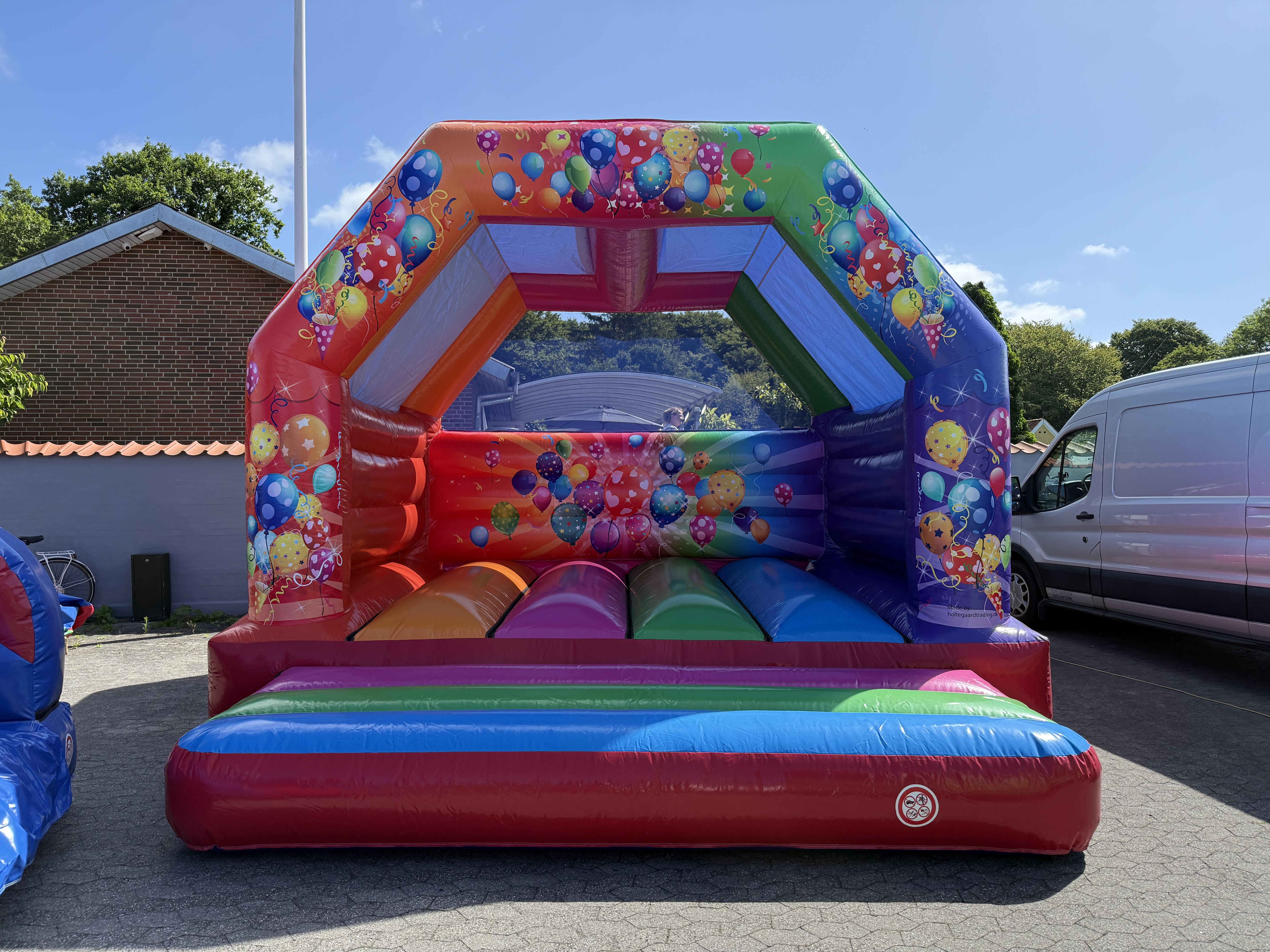 Eight shirts arranged on table in black, olive, grey, blue, white, red, mustard, and green.