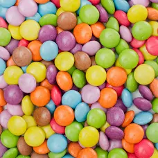 Eight shirts arranged on table in black, olive, grey, blue, white, red, mustard, and green.