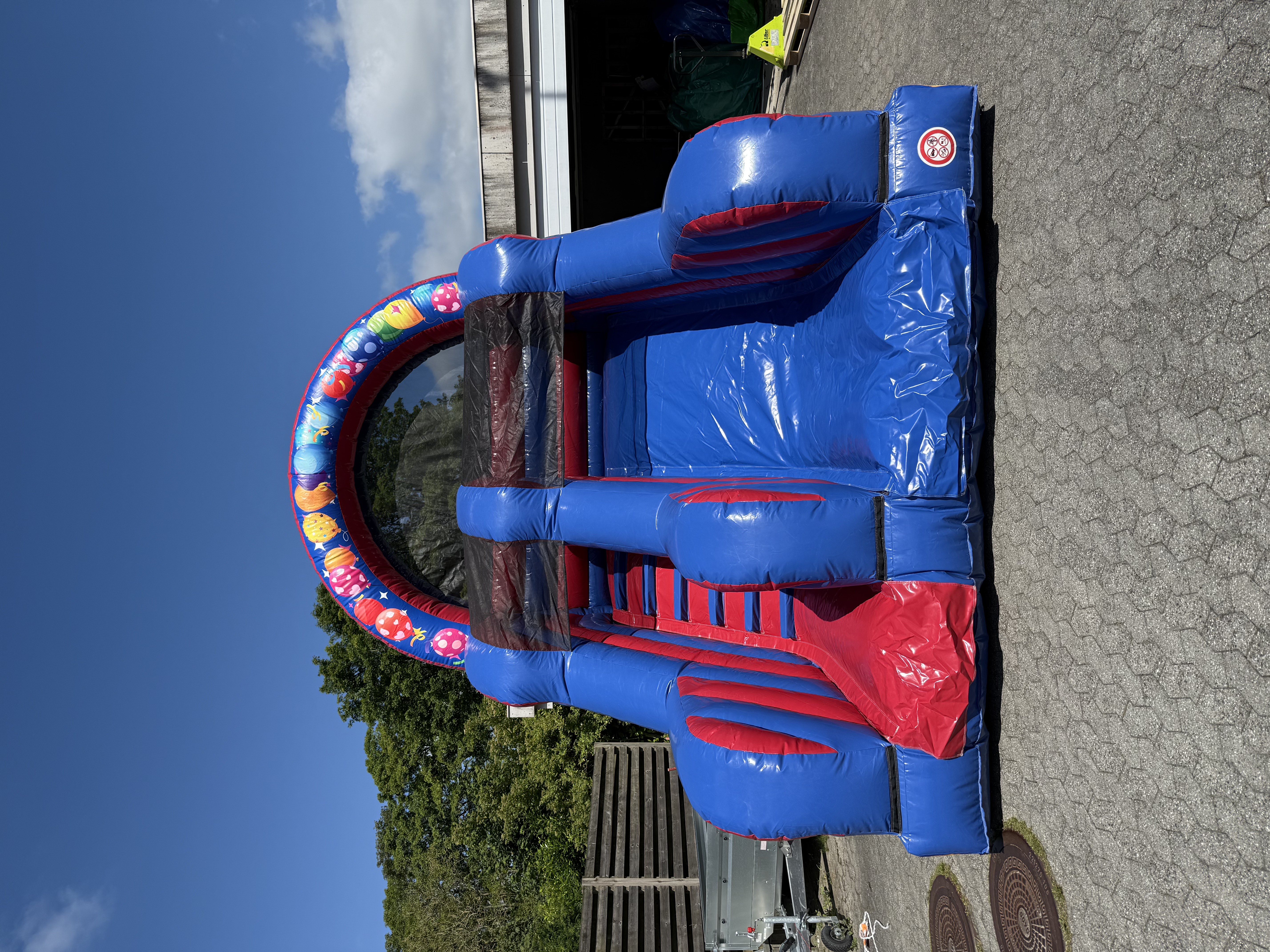 Eight shirts arranged on table in black, olive, grey, blue, white, red, mustard, and green.